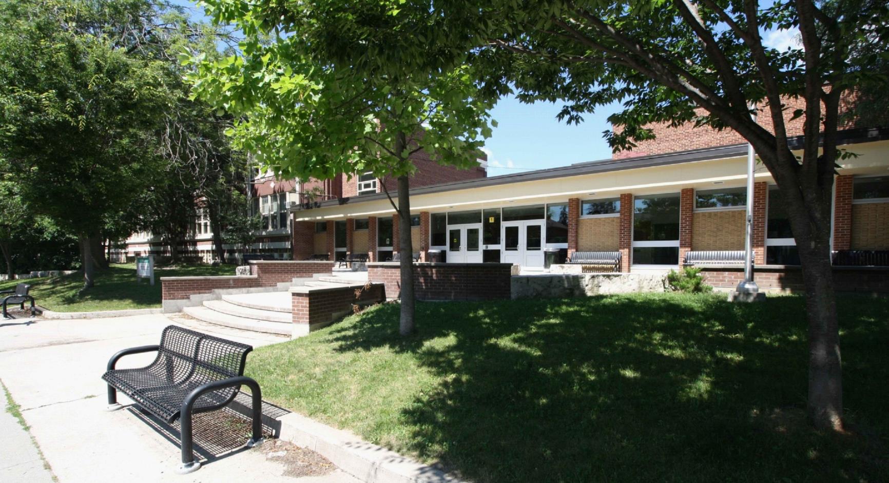 Picture of the existing main entrance looking from Davisville Ave. Open Gallery